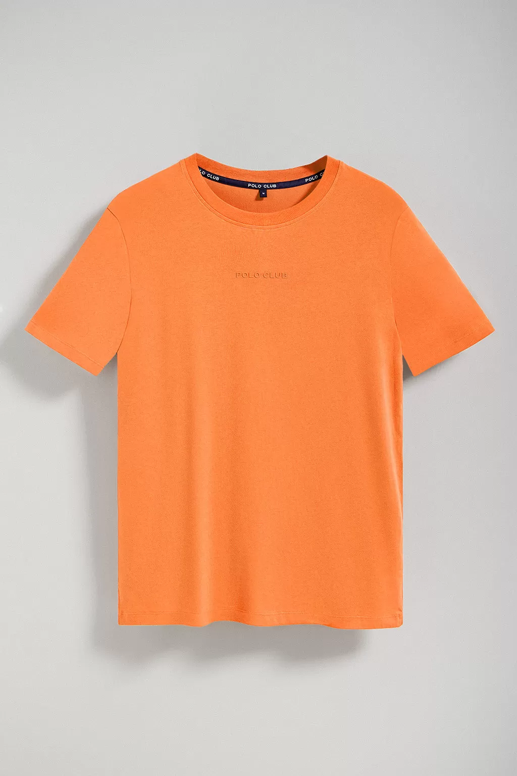 Camiseta Surfer loose fit naranja suave con logo minimal engomado Polo Club