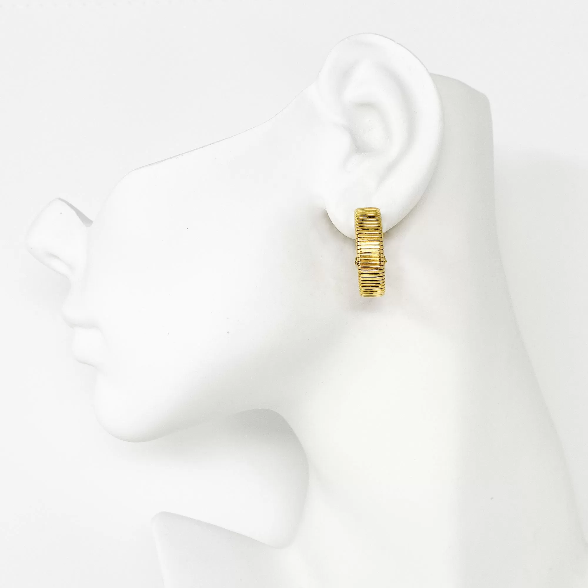 KRYSTAL gold tone omega hoop clip earrings