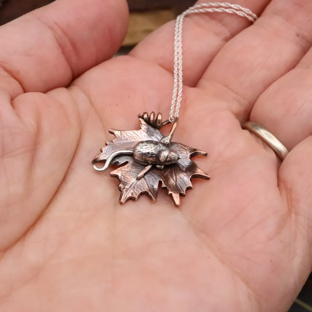 Tiny Mouse on her Maple Leaf Necklace